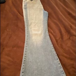 Wide Bell Bottom Faded Jeans.